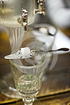 Absinth glass and fountain photo