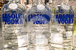 Absolut Vodka logo on some bottles for sale. Absolut a brand of Swedish Vodka produced by the Pernod Ricard corporation.