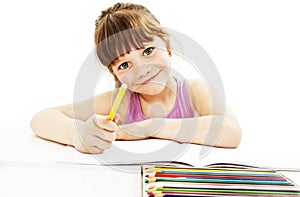 Absorbed little girl drawing with colorful pencils