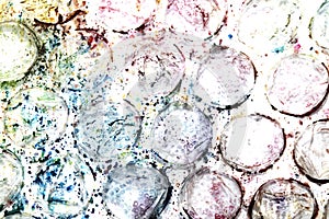 Absract background of shiny plastic and bubbles dreating bright sci-fi style texture background