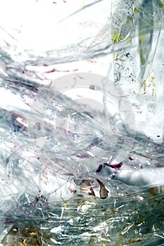 Absract background of shiny plastic and bubbles dreating bright sci-fi style texture background