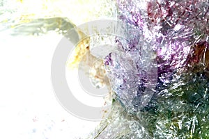 Absract background of shiny plastic and bubbles dreating bright sci-fi style texture background