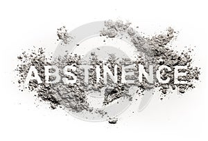 Abstinence word written in ash, sand or dust photo