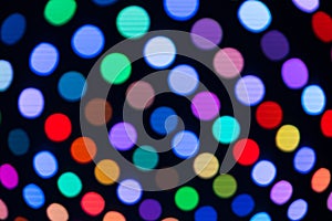 Abstract light circles blurry on a black background