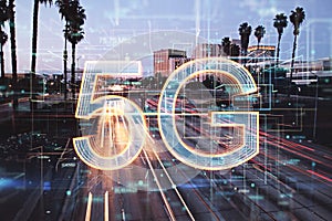 Abstract 5G hologram on blurry LA city background. Internet and connectivity concept.