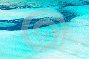 Abstract aerial view of a lagoon with turquoise pristine water photo