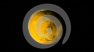 Abstract animation of yellow planet covering with ice and rotating on the black background. Animation. The process of