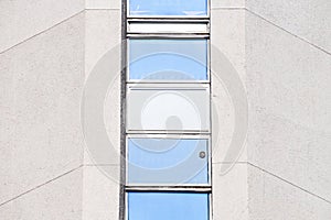 Abstract architectural detail of a concrete office building window section from the isolated facade