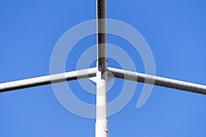 Abstract architectural street light post detail isolated with blue sky background