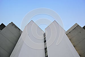 Abstract architecture background. Vanishing point against a blue sky.