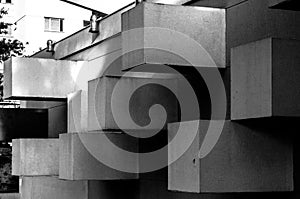 Abstract architecture made of concrete with square blocks sticking out of the wall