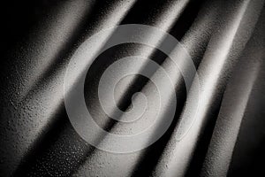 Abstract art background featuring black cloth with desaturated particles and animated textures. A striking design for wallpaper photo