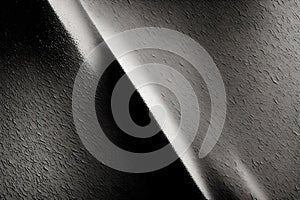 Abstract art background featuring black cloth with desaturated particles and animated textures. A striking design for wallpaper photo