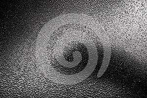 Abstract art background featuring black cloth with desaturated particles in motion. Cloth animation creates a dynamic and textured photo