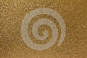 Abstract art background of sparkling gold color glitter texture