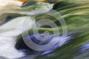 Abstract art of motion blur water surface on the rock natural color painting and design