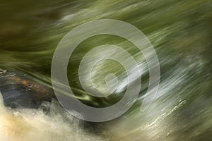 Abstract art of motion blur water surface on the rock natural color painting and design