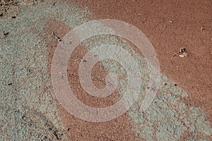 Red earth with furrows after rainwater