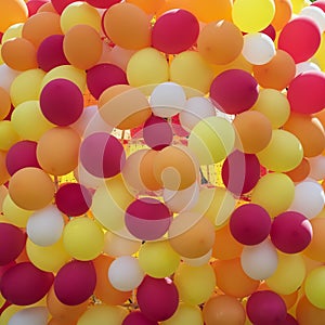 Abstract background of balloons in golden orange-red colors. Festive concept with texture