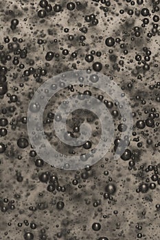 Abstract background with black and white bubbles.