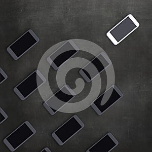 Abstract background with black and white mobile phones.