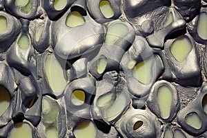 Abstract background of black and white pebble stones with holes