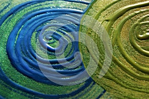 Abstract background. Blue and green swirl drawn with acrylic paint.