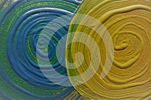 Abstract background. Blue and green swirl drawn with acrylic paint.