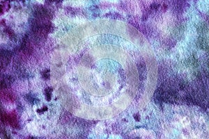 Abstract Background of Blue and Purple Tie-Dye Swirls on Fabric