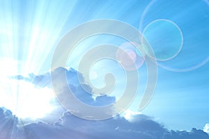 Abstract Background : Blue sky with sunray protruding from cloud