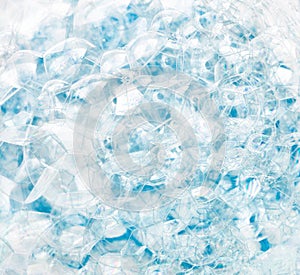 Abstract background of blue soap bubbles. Concept of cleansing