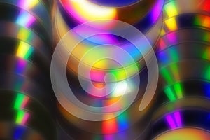 Abstract background of blurred colorful spectra on cd and dvd di photo