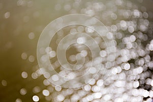 Abstract background blurred white bokeh circles disperse around