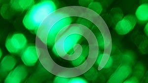 Abstract background with blurry green bokeh lights