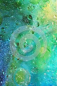 Abstract Background with Bubbles in Green and Blue