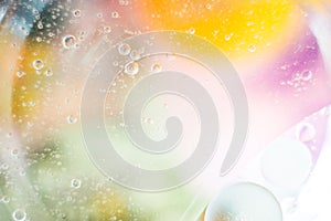 Abstract background with bubbles oil drops on the water surface