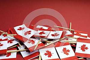 Abstract background of Canada red and white Maple Leaf national toothpick flags - closeup