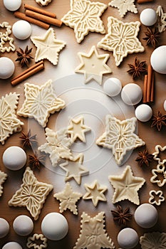 Abstract background with Christmas raw dough star cookies, spices and white baubles.