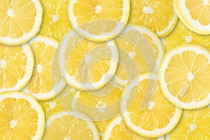 Abstract background with citrus-fruit of lemon slices. Close-up. Studio photography