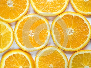 Abstract background with citrus-fruit of orange slices. Close-up.