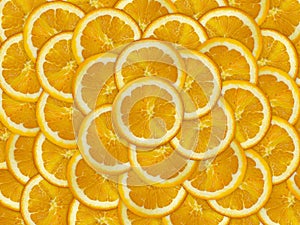 Abstract background with citrus-fruit of orange slices. Close-up. orange cut into slices is lying on the table.