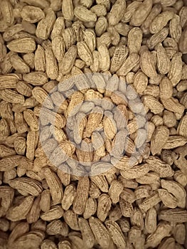 abstract background of close up roasted peanuts