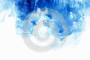 Abstract background color ink drop in water. Blue cloud of paint on white.