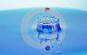Abstract background color water splash, collision of colored drops and crown creation, concept art with abstract effect