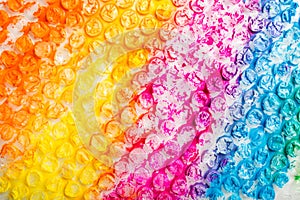 Abstract background of colored bubble wrap painted