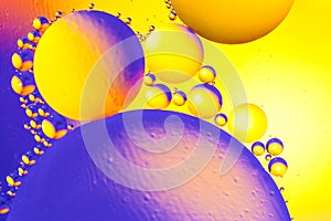 Abstract background with colorful gradient colors. Oil drops in water abstract psychedelic pattern image. Blue orange yellow color