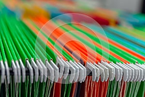 Abstract background colorful hanging file folders in drawer.