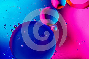 Abstract background with colorful pink blue gradient colors. Oil drops in water abstract psychedelic pattern image
