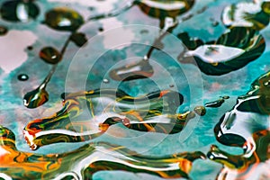 abstract background of colorful water drops on the surface of the water.