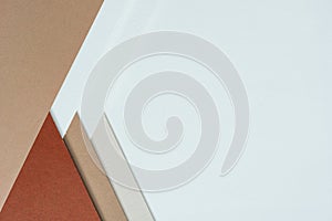 abstract background concept with pattern of earth tones colour paper, layers of blank brown paper and white, cream colour, beige